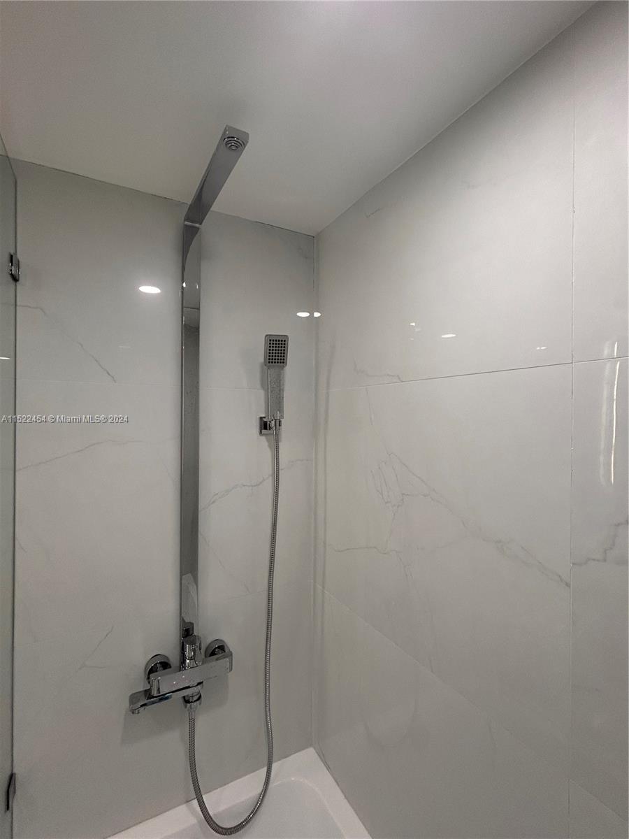 7601 East Treasure Drive, Unit PH206 North Bay Village, FL 33141 - Photo 19 of 24 a bathroom with a shower