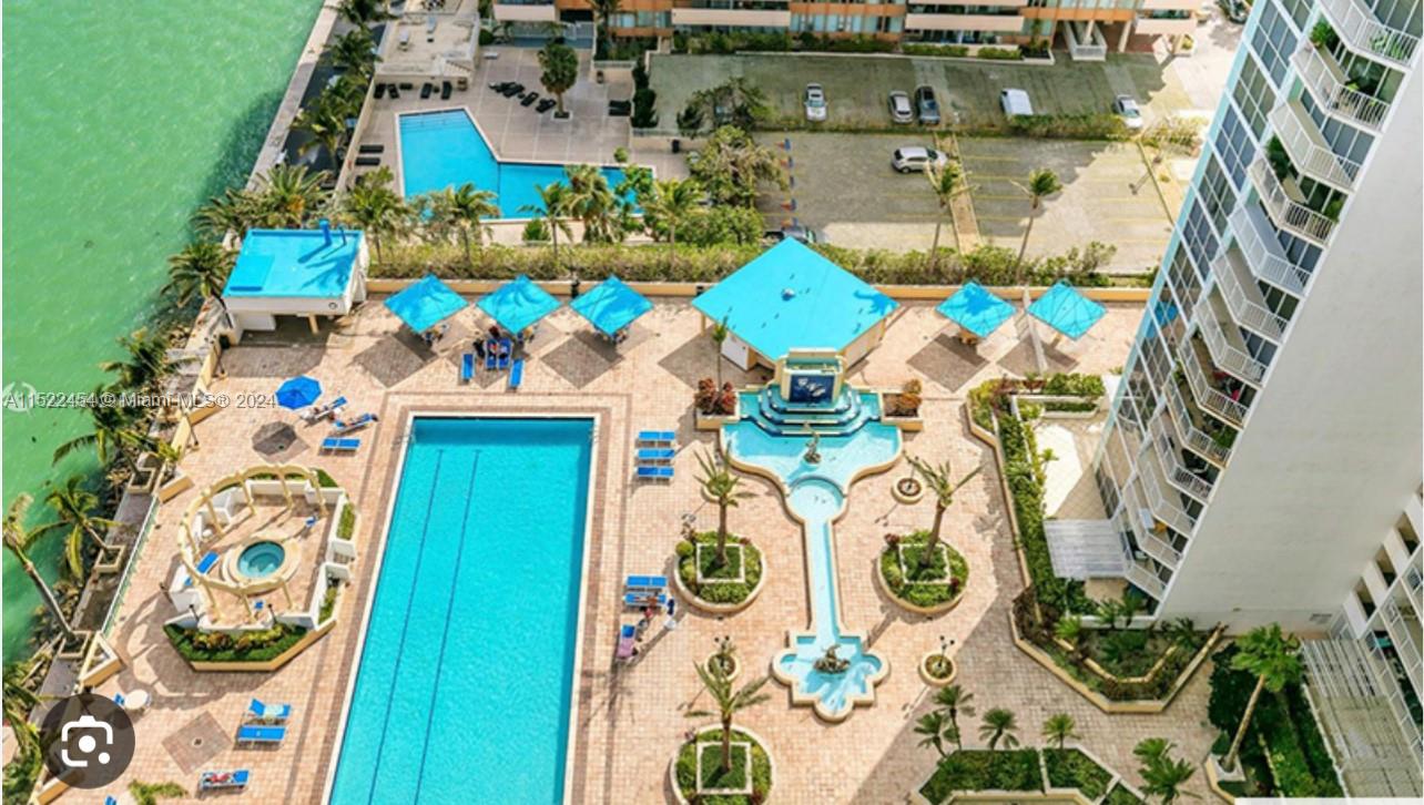 7601 East Treasure Drive, Unit PH206 North Bay Village, FL 33141 - Photo 24 of 24 an aerial view of a fireplace a book and a table