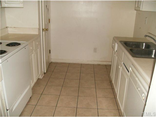1601 Rose Raleigh, NC 27610 - Photo 2 of 3 a view of a kitchen that has a sink and a stove