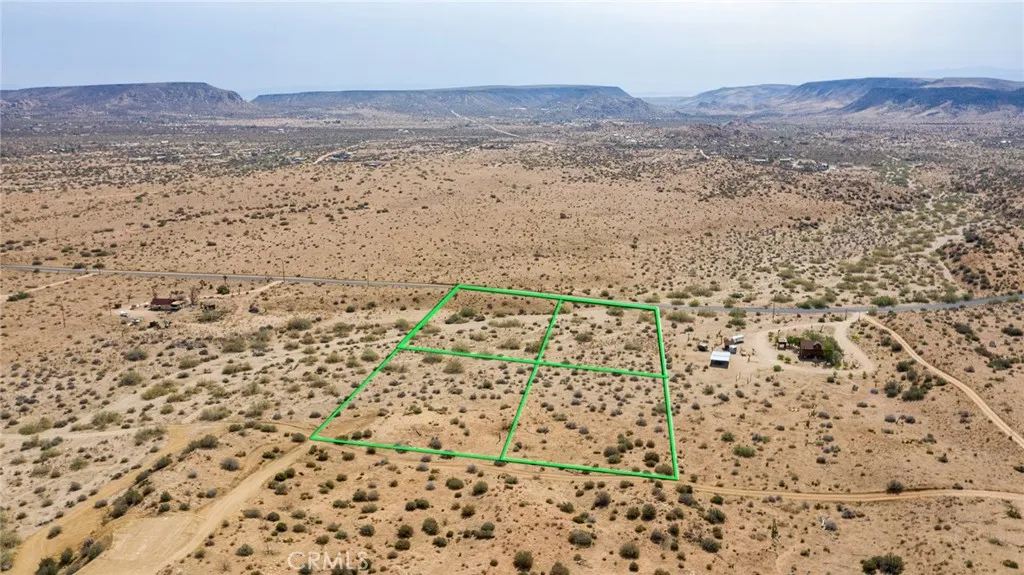 1000 Rimrock Road Pioneertown, CA 92268 - Photo 15 of 20 a view of a dry yard and mountain view