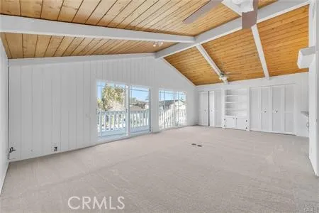 a view of an empty room with windows