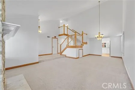 a view of an empty room with stairs