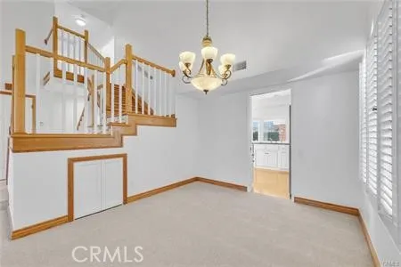 a view of an entryway with chandelier