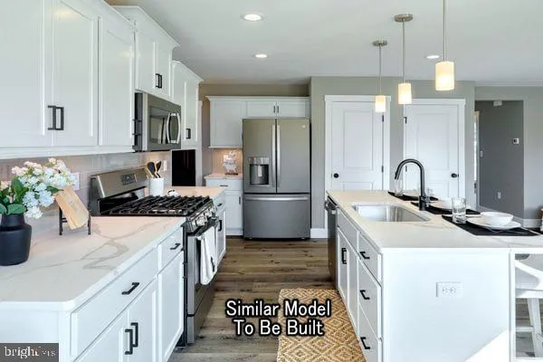 a kitchen with a sink stove and refrigerator
