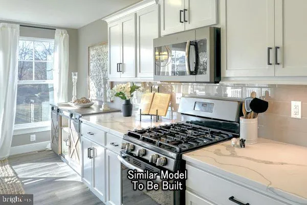 a kitchen with a stove and a sink