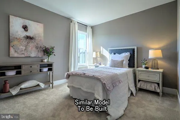 a spacious bedroom with a bed and a painting on the wall