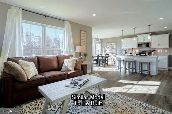 a living room with lots of furniture and a table