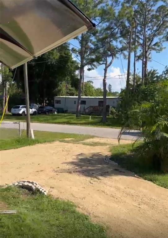 15482 Mapletree Drive Punta Gorda, FL 33955 - Photo 12 of 12 a view of swimming pool with deck and yard