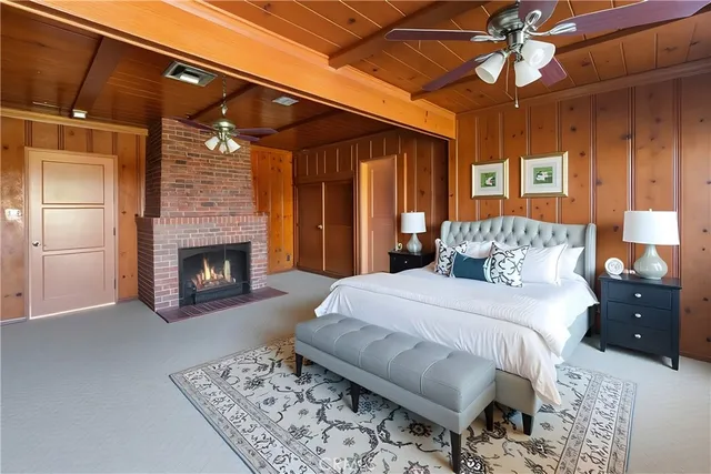 a bedroom with a bed and a fireplace