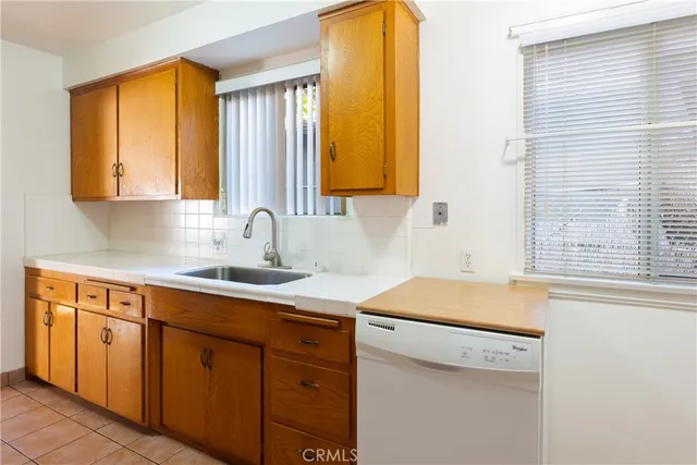 a kitchen with a sink and a window