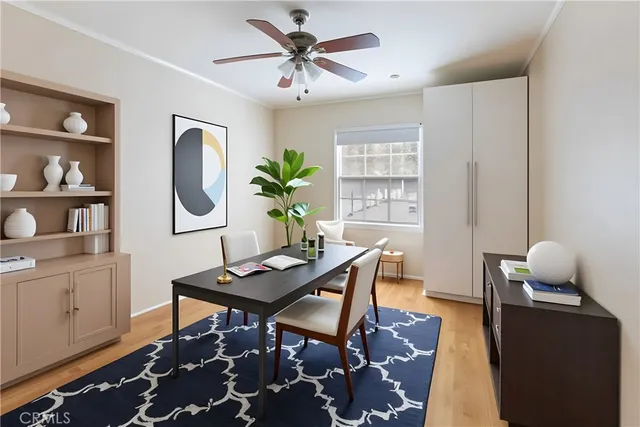 a work room with furniture and wooden floor