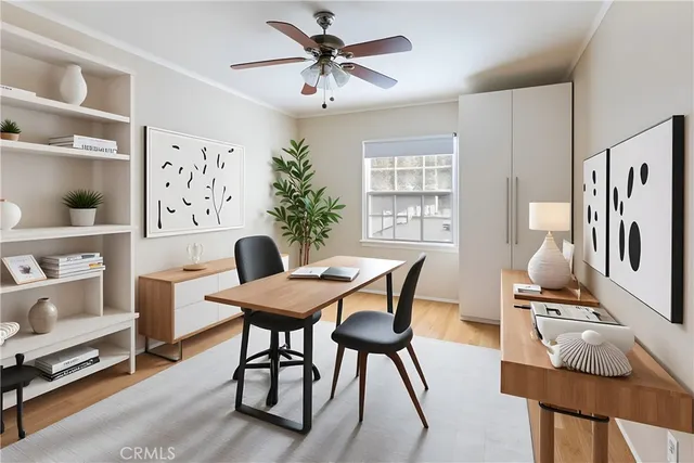 a view of a dining room with furniture and a window