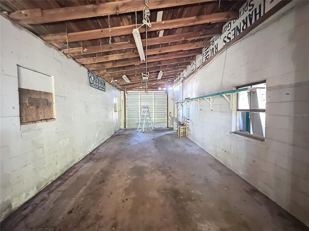 110 Reynolds Road Deleon Springs, FL 32130 - Photo 14 of 27 a view of empty room with wooden ceiling