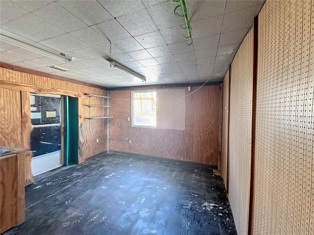 110 Reynolds Road Deleon Springs, FL 32130 - Photo 4 of 27 a view of empty room with wooden floor and fan