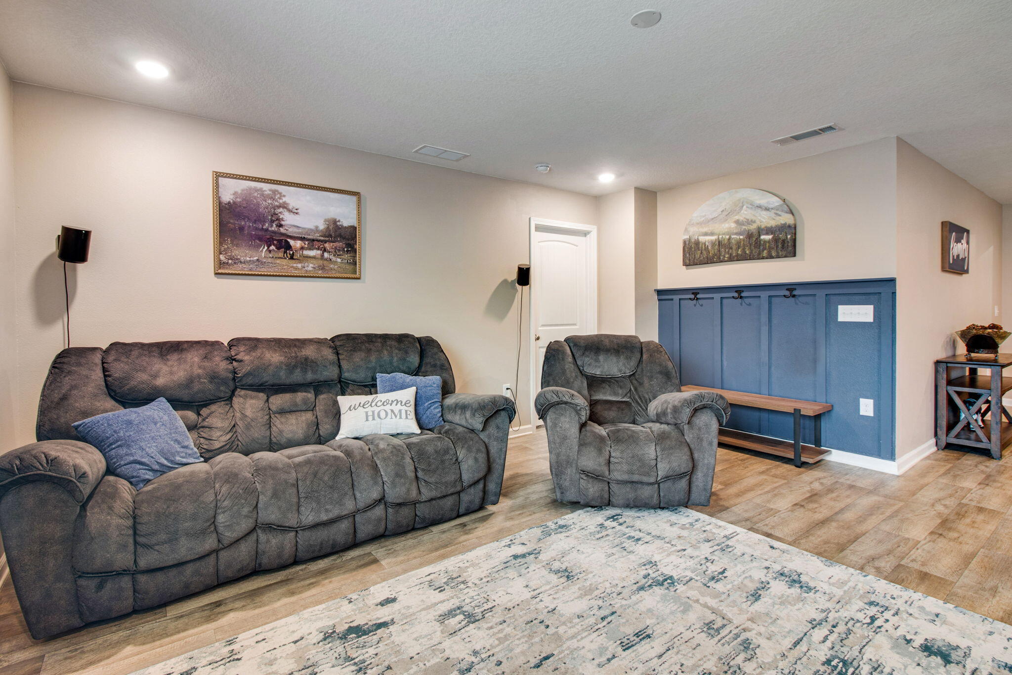 1032 Limpkin Street Crestview, FL 32539 - Photo 11 of 29 a living room with couches a large couch and dresser with wooden floor
