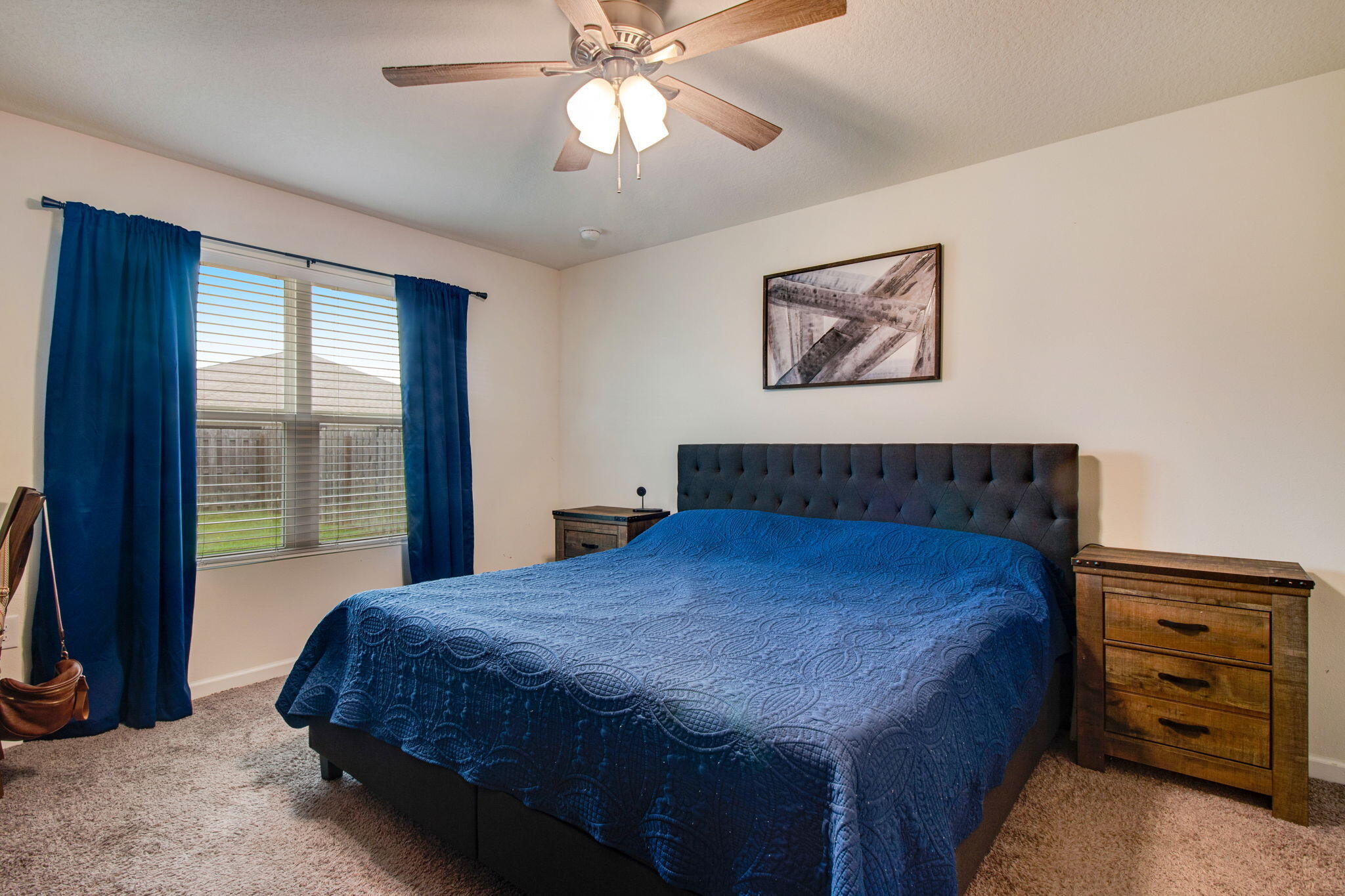 1032 Limpkin Street Crestview, FL 32539 - Photo 14 of 29 a bedroom with a bed and a chandelier