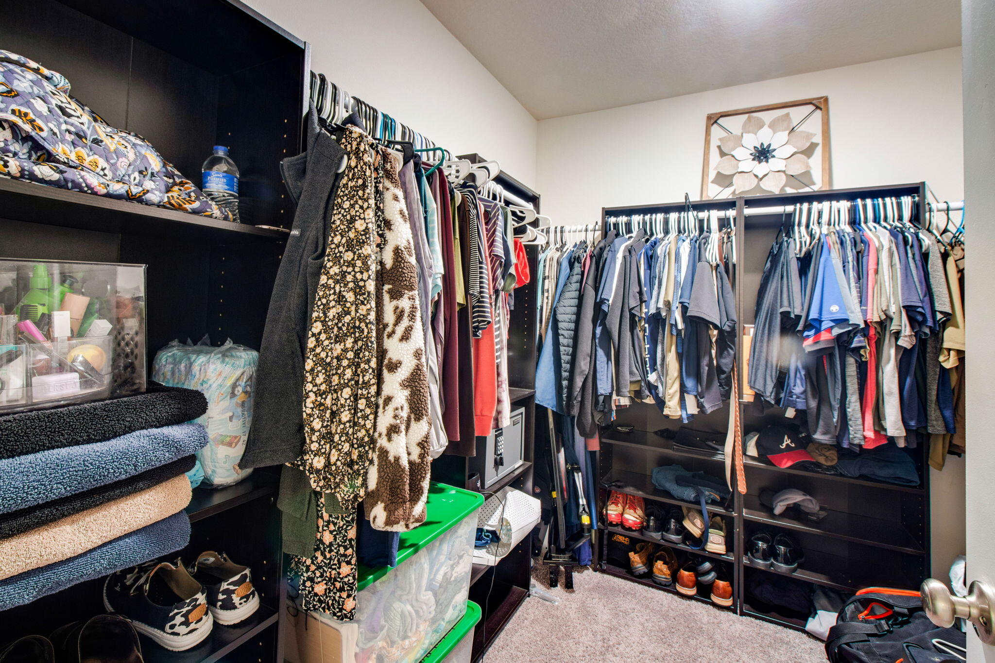 1032 Limpkin Street Crestview, FL 32539 - Photo 17 of 29 a view of walk in closet with clothes