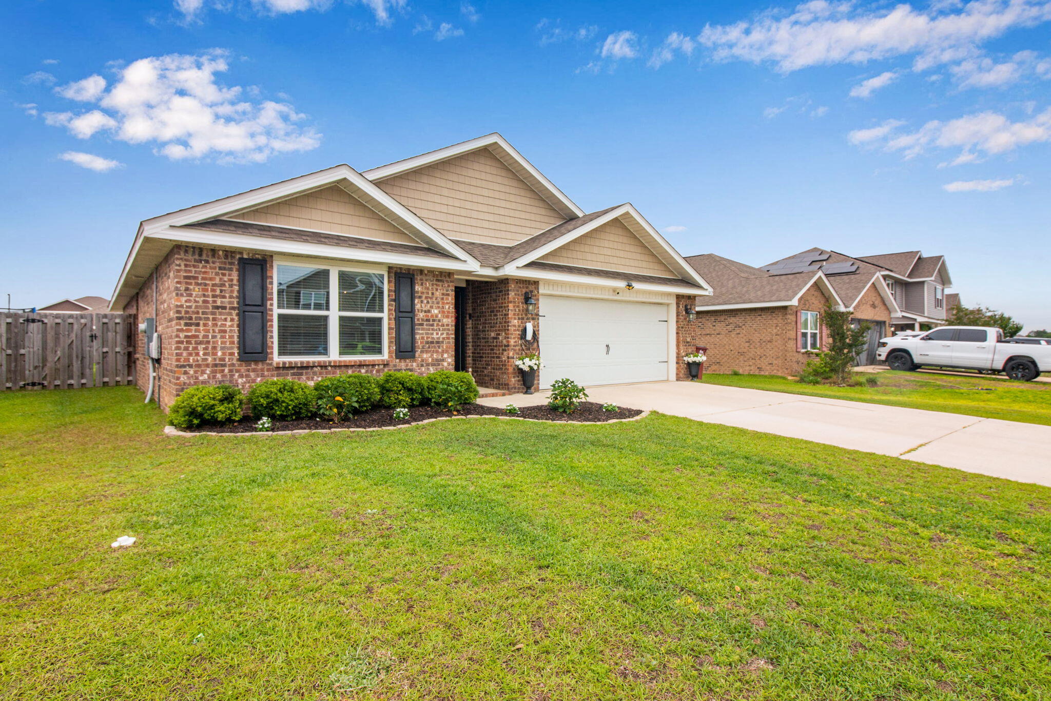 1032 Limpkin Street Crestview, FL 32539 - Photo 2 of 29 a front view of a house with garden