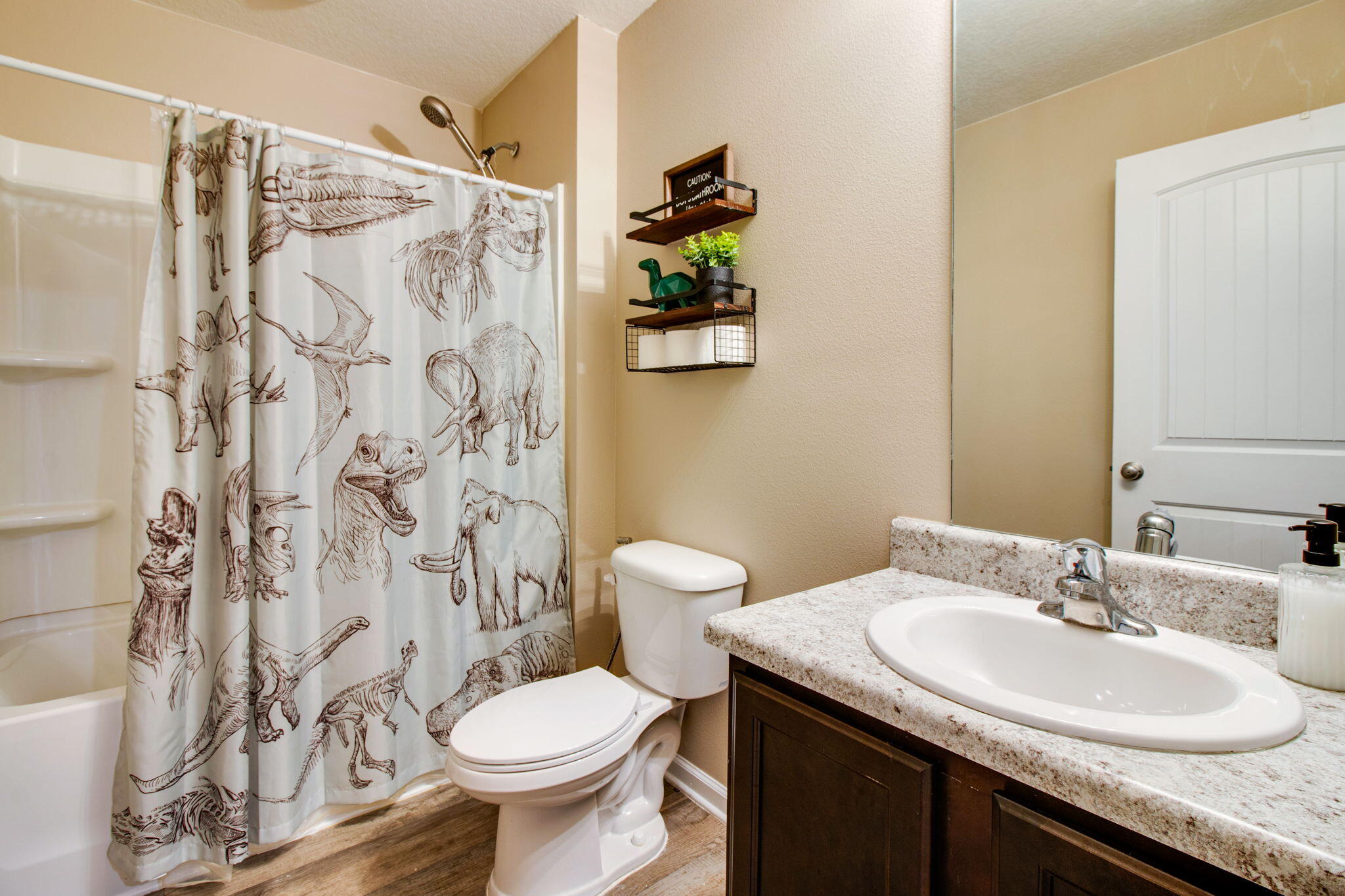 1032 Limpkin Street Crestview, FL 32539 - Photo 25 of 29 a bathroom with a granite countertop sink toilet and a mirror