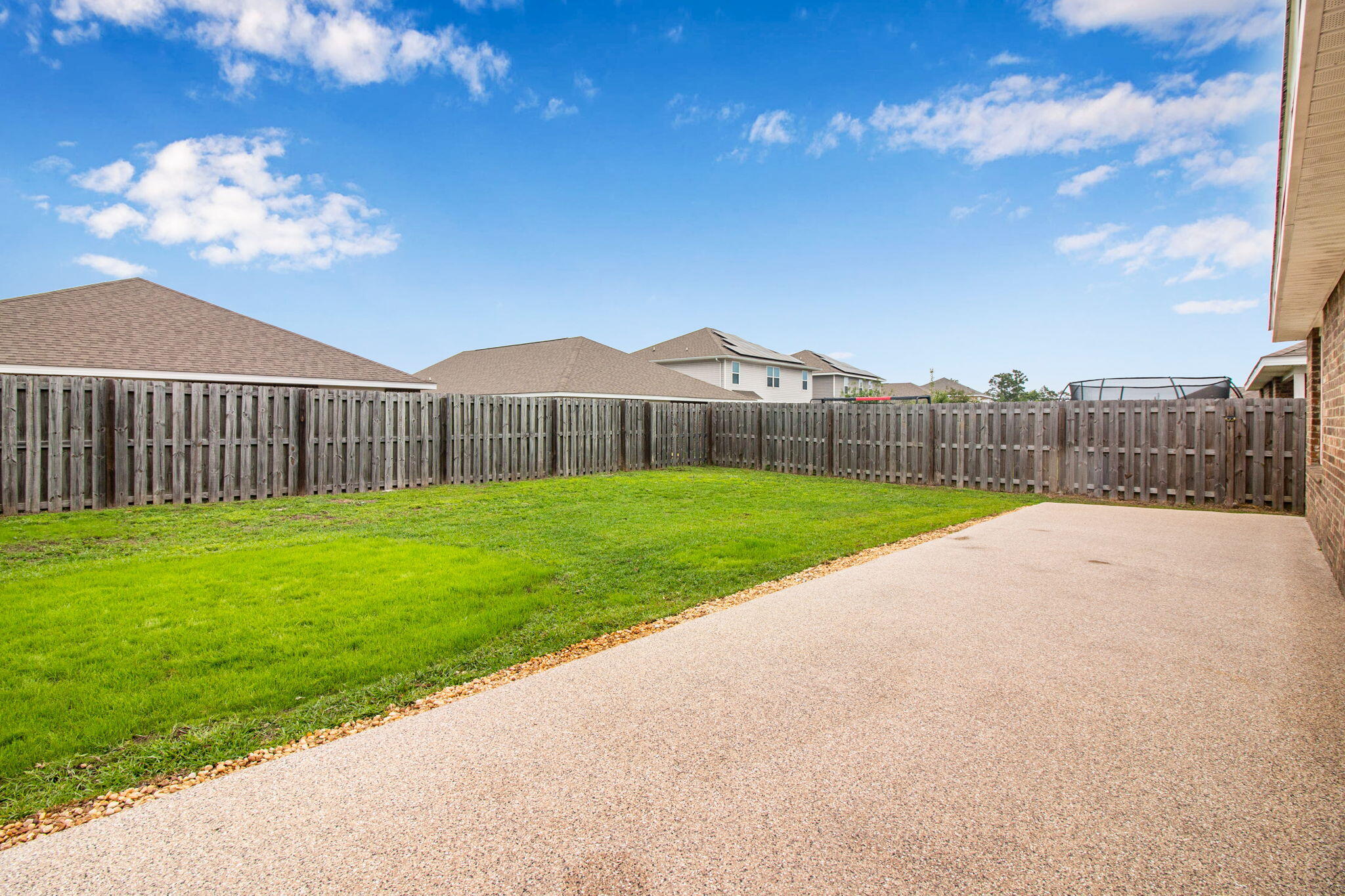 1032 Limpkin Street Crestview, FL 32539 - Photo 29 of 29 a view of green field with a small yard in the back