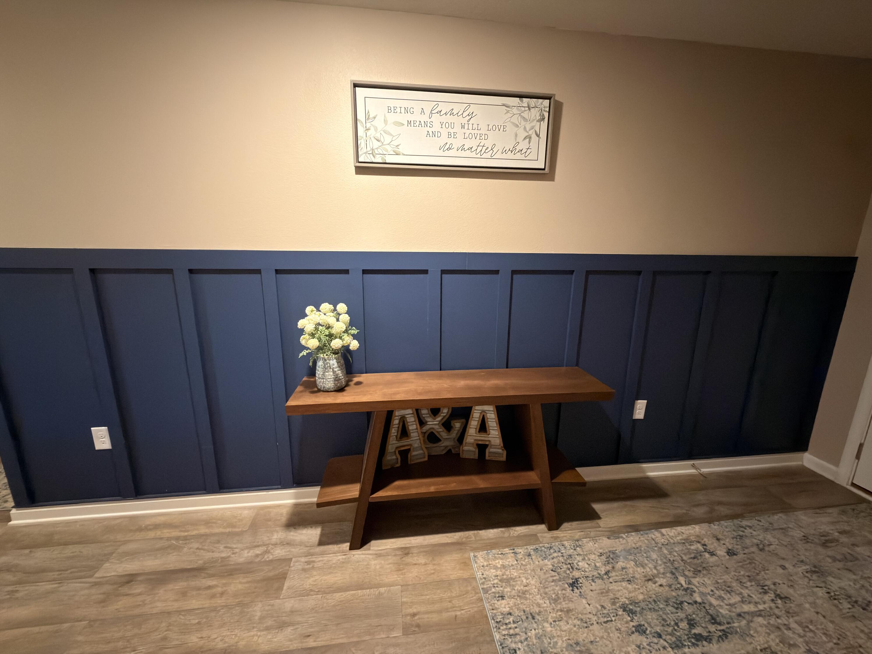 1032 Limpkin Street Crestview, FL 32539 - Photo 3 of 29 a bed sitting in a bedroom next to a wooden door