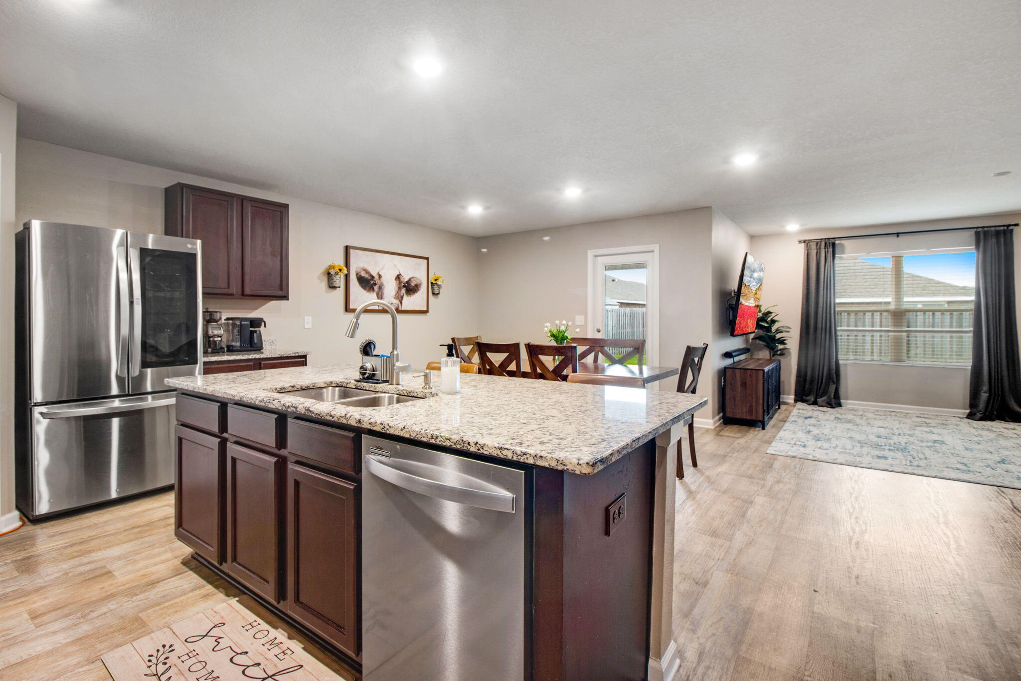 1032 Limpkin Street Crestview, FL 32539 - Photo 7 of 29 a kitchen with stainless steel appliances granite countertop a sink stove and refrigerator