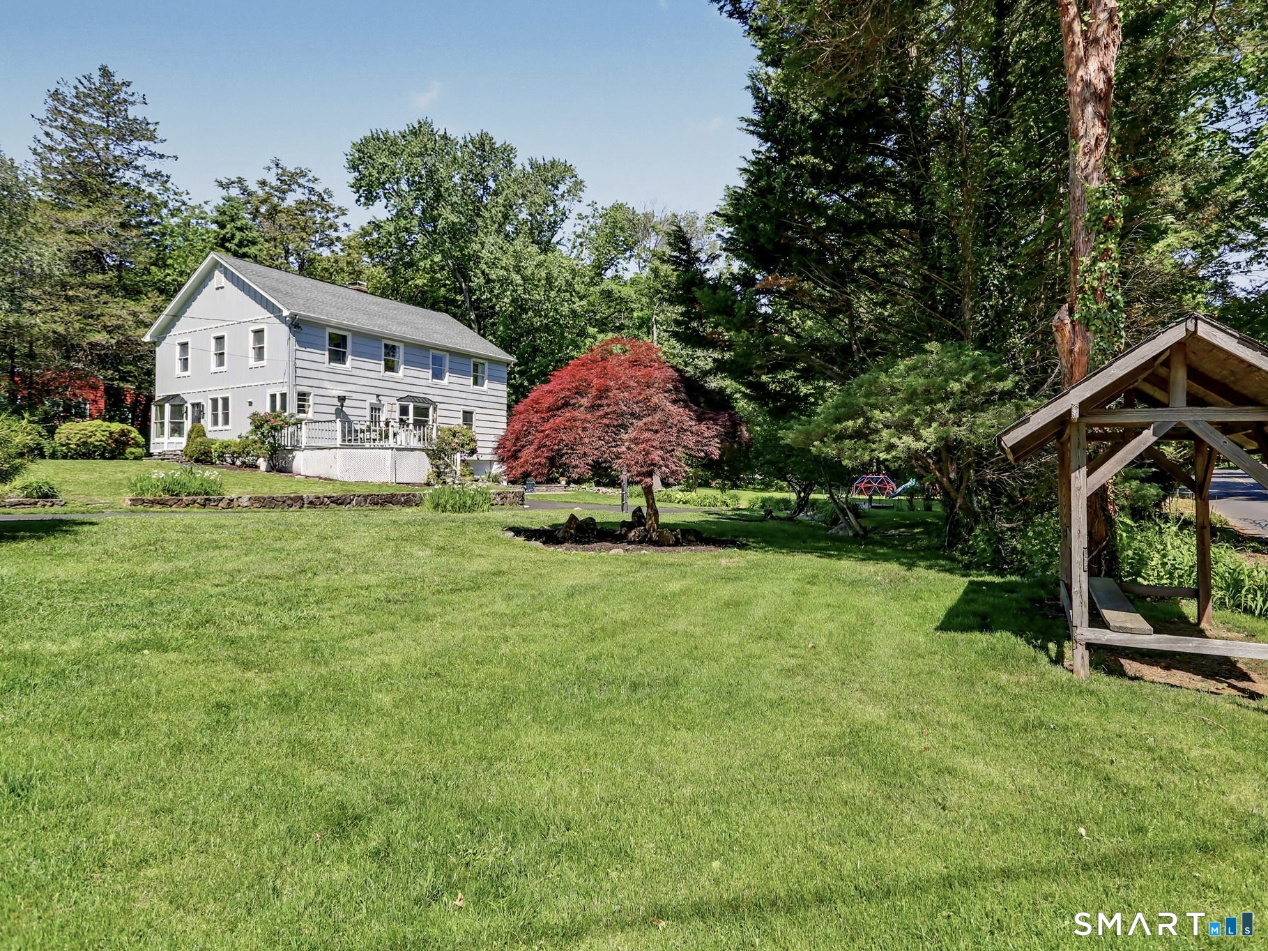 2 Rising Road Norwalk, CT 06850 - Photo 29 of 33 a front view of a house with garden
