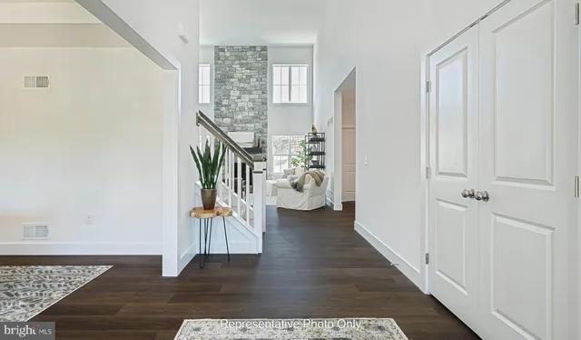 a view of an entryway with wooden floor