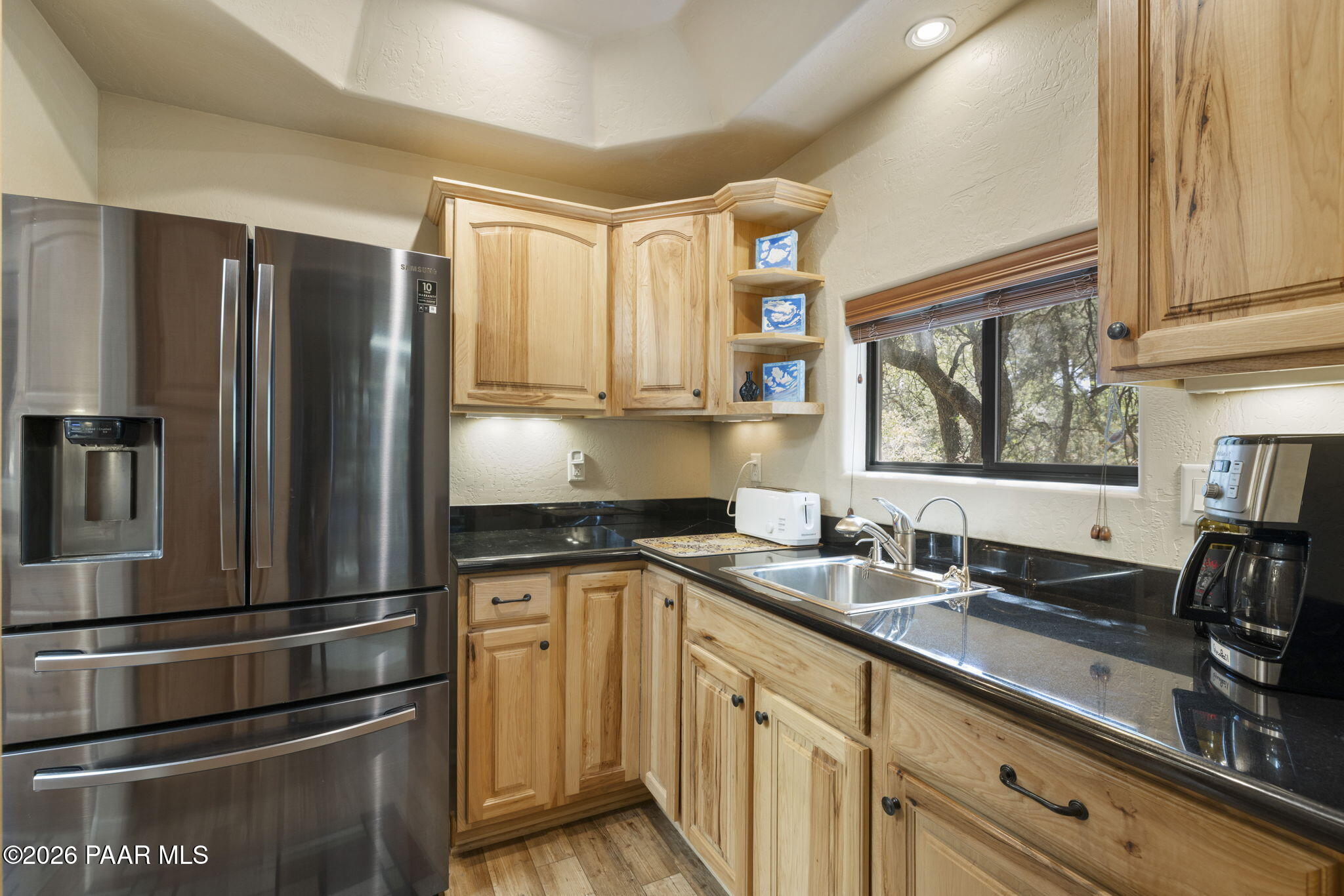535 Copper Basin Road Prescott, AZ 86303 - Photo 15 of 41 a kitchen with granite countertop stainless steel appliances a sink stove and refrigerator