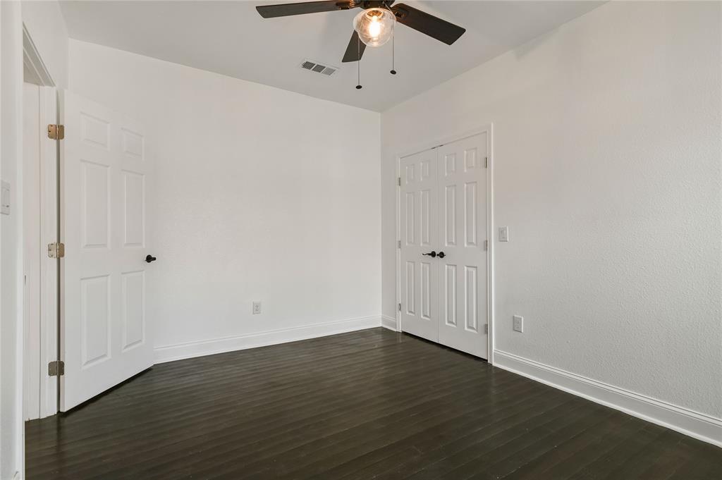 1106 West Chestnut Street Denison, TX 75020 - Photo 14 of 29 a view of an empty room with wooden floor