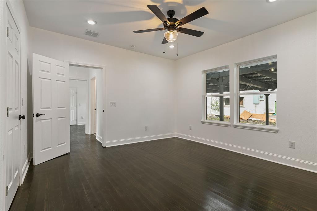 1106 West Chestnut Street Denison, TX 75020 - Photo 18 of 29 an empty room with a empty space and windows