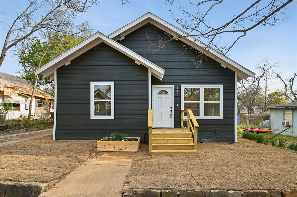 1106 West Chestnut Street Denison, TX 75020 - Photo 2 of 29 a front view of a house with large windows