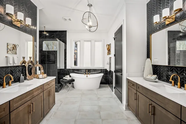 a bathroom with a sink vanity mirror and toilet