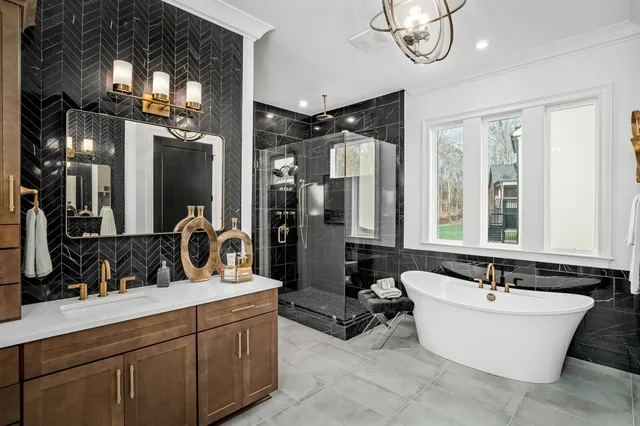 a bathroom with a sink mirror and toilet