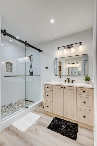 a bathroom with a double vanity sink and mirror