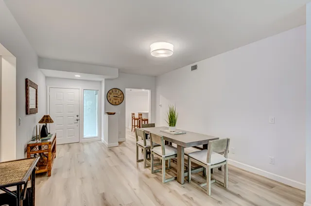 a kitchen with stainless steel appliances a refrigerator and a stove top oven