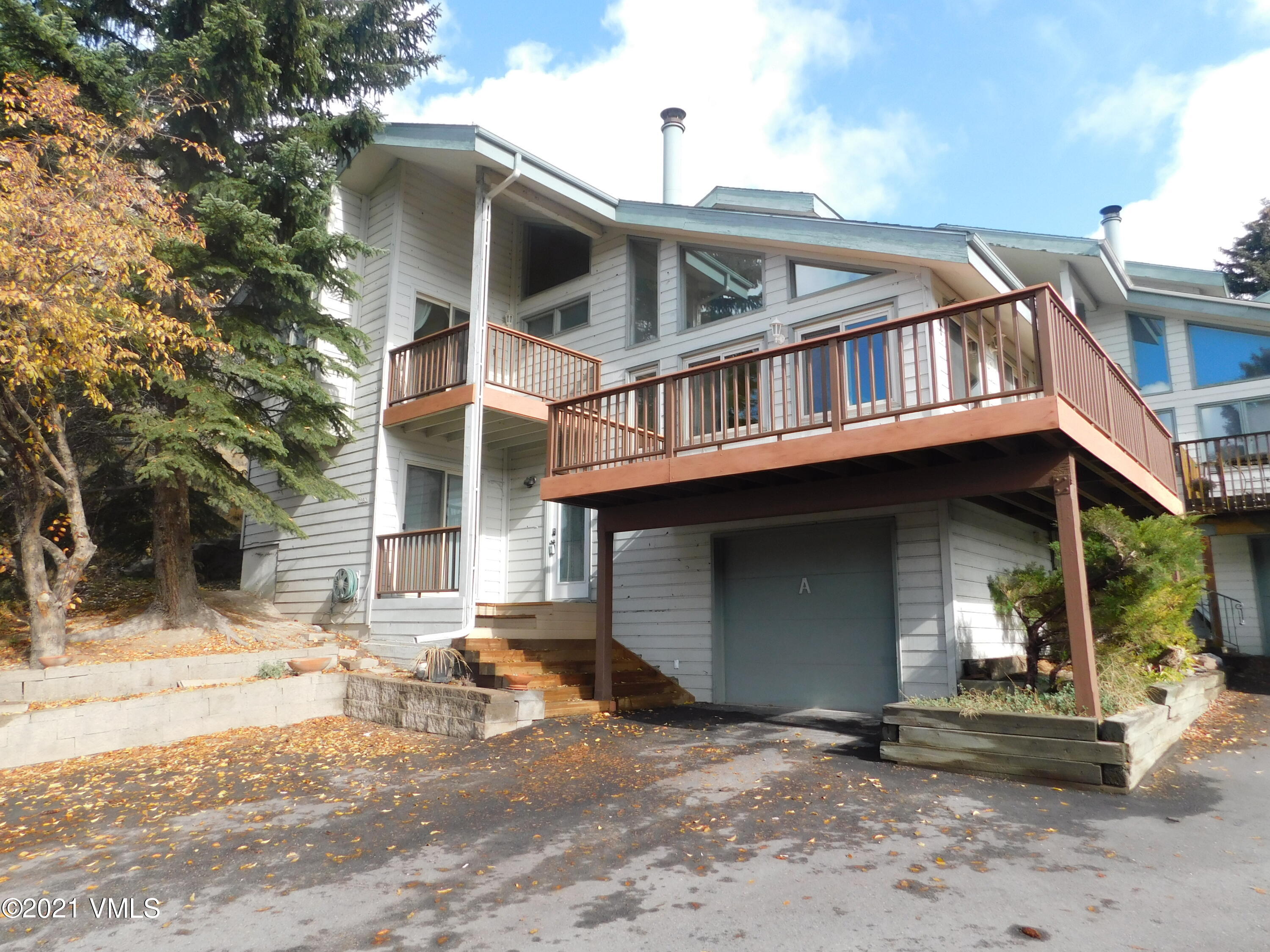 230 Nottingham Road, Unit A Avon, CO 81620 - Photo 2 of 12 a front view of a house with a yard