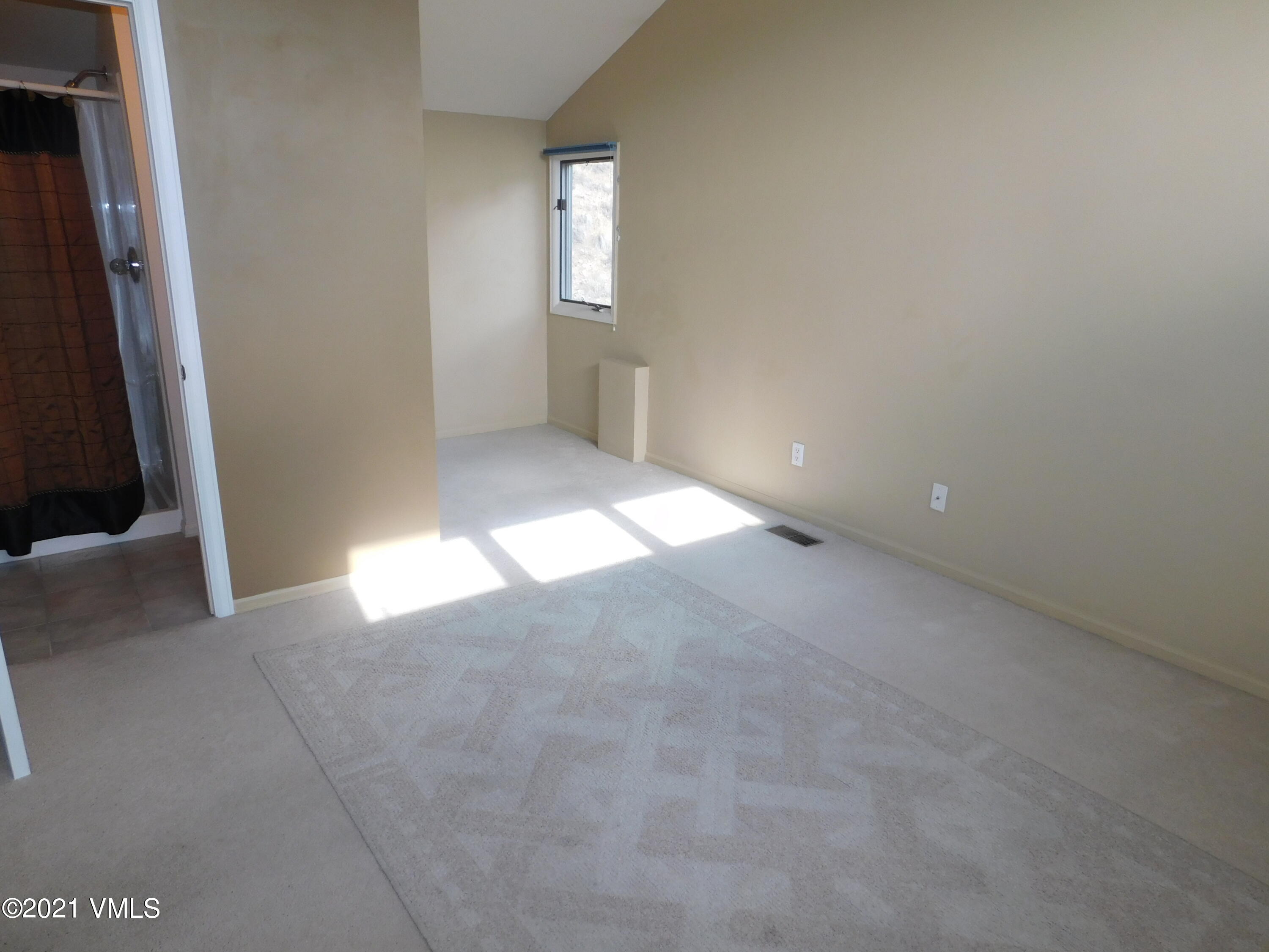 230 Nottingham Road, Unit A Avon, CO 81620 - Photo 7 of 12 a view of an empty room and a window