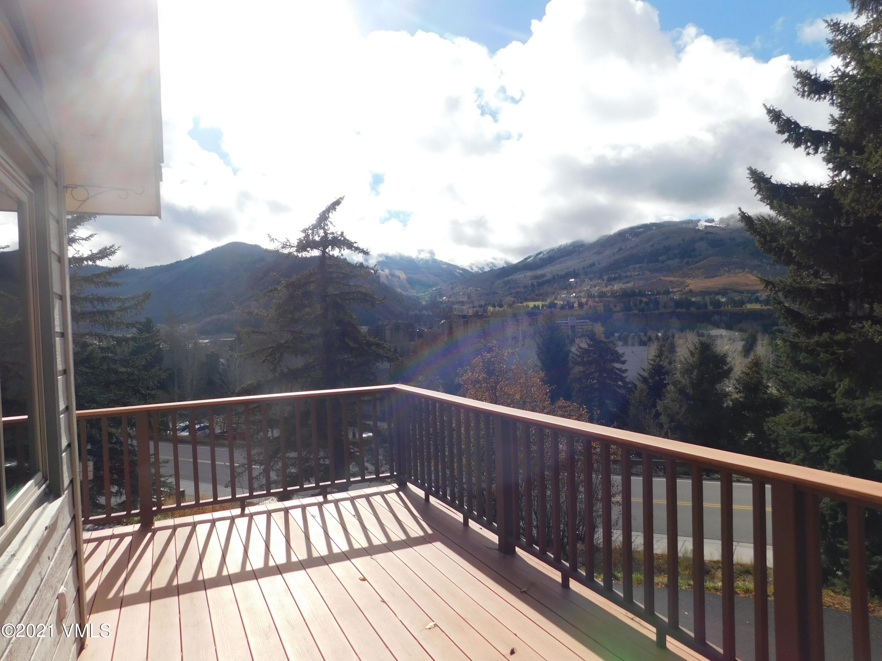 230 Nottingham Road, Unit A Avon, CO 81620 - Photo 9 of 12 a view of balcony with wooden floor and fence