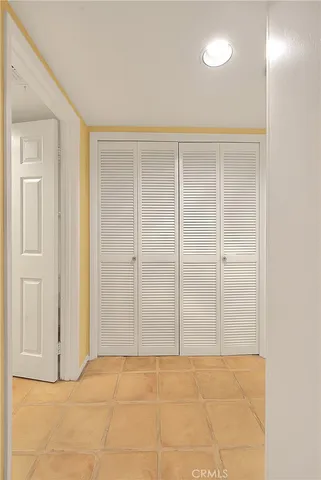 a bedroom with furniture and a flat screen tv