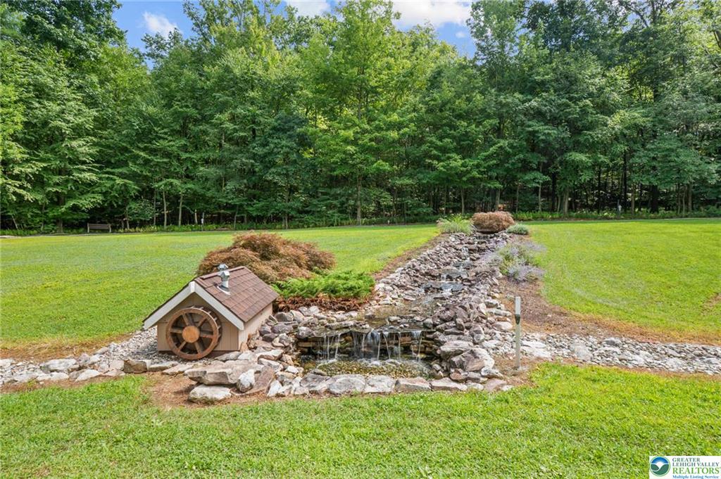 1222 Spring Road Andreas, PA 18211 - Photo 34 of 44 Water feature ~ Elaborately done
sets the tone for this nature inspired
home