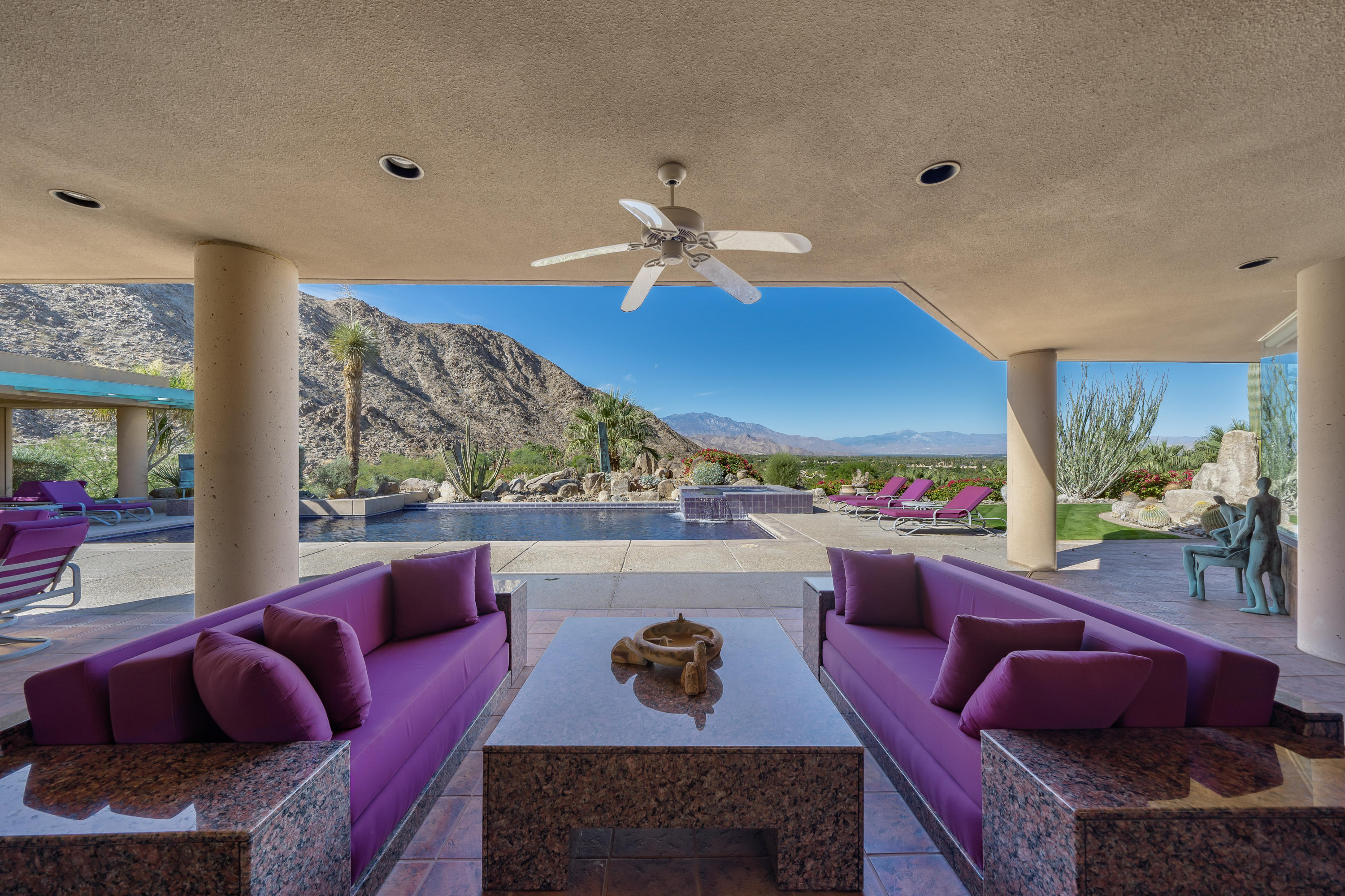 75270 Hidden Cove Indian Wells, CA 92210 - Photo 2 of 73 a living room with furniture a rug and a chandelier