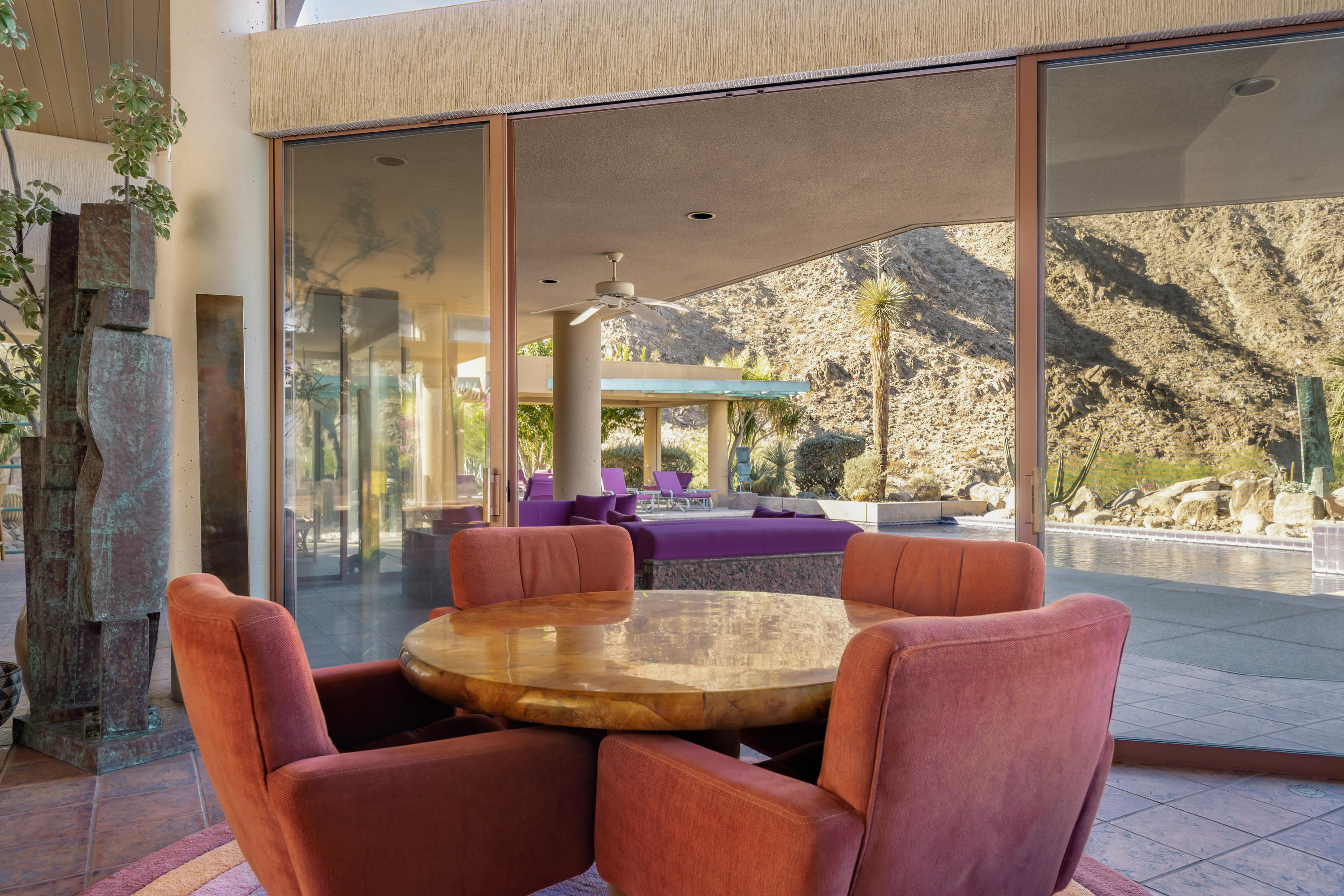 75270 Hidden Cove Indian Wells, CA 92210 - Photo 12 of 73 a living room with furniture a lamp and a floor to ceiling window