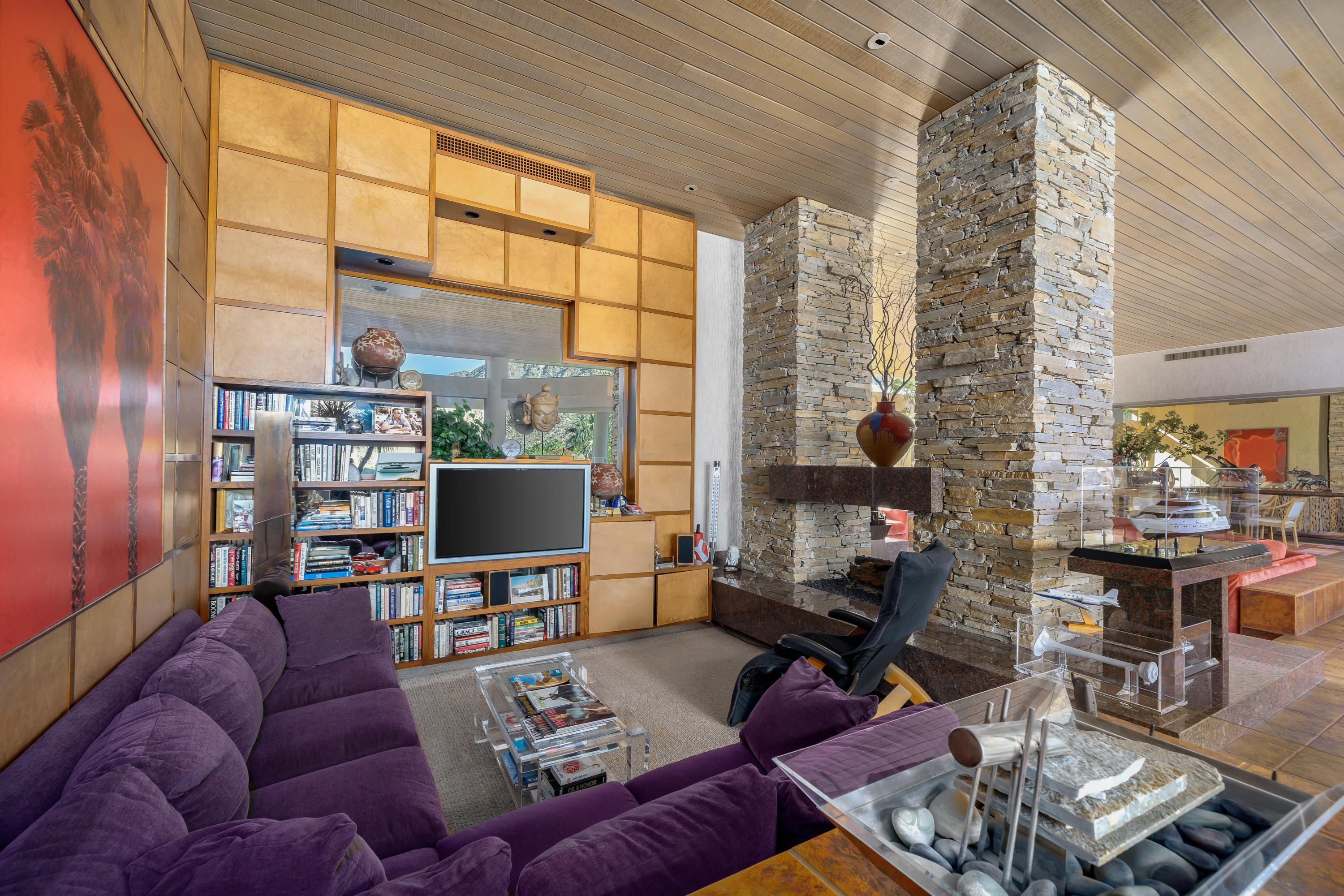 75270 Hidden Cove Indian Wells, CA 92210 - Photo 16 of 73 a living room with furniture a flat screen tv and a floor to ceiling window