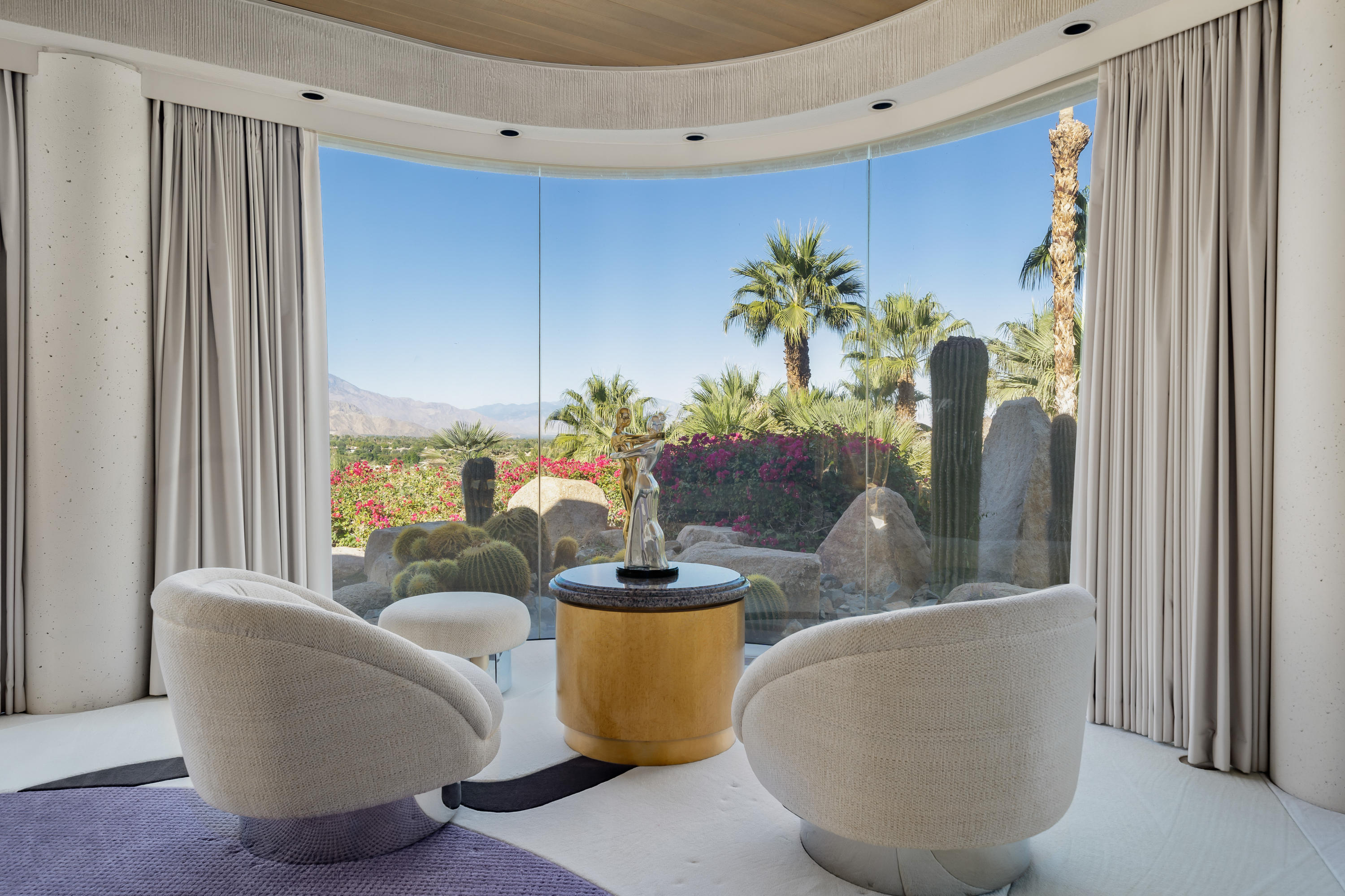 75270 Hidden Cove Indian Wells, CA 92210 - Photo 22 of 73 a living room with furniture and a potted plant