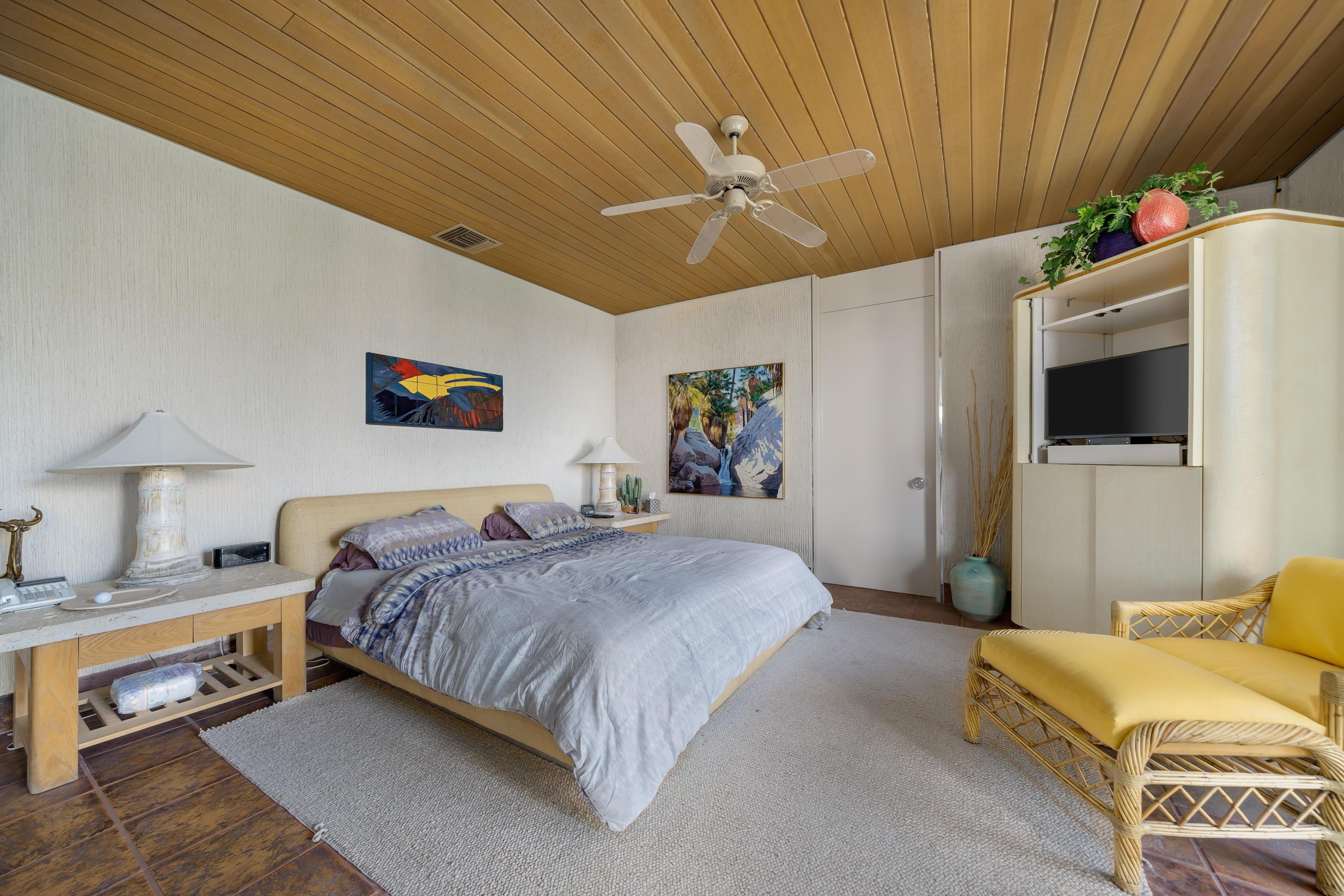 75270 Hidden Cove Indian Wells, CA 92210 - Photo 39 of 73 a bedroom with a bed and a flat tv screen on dresser