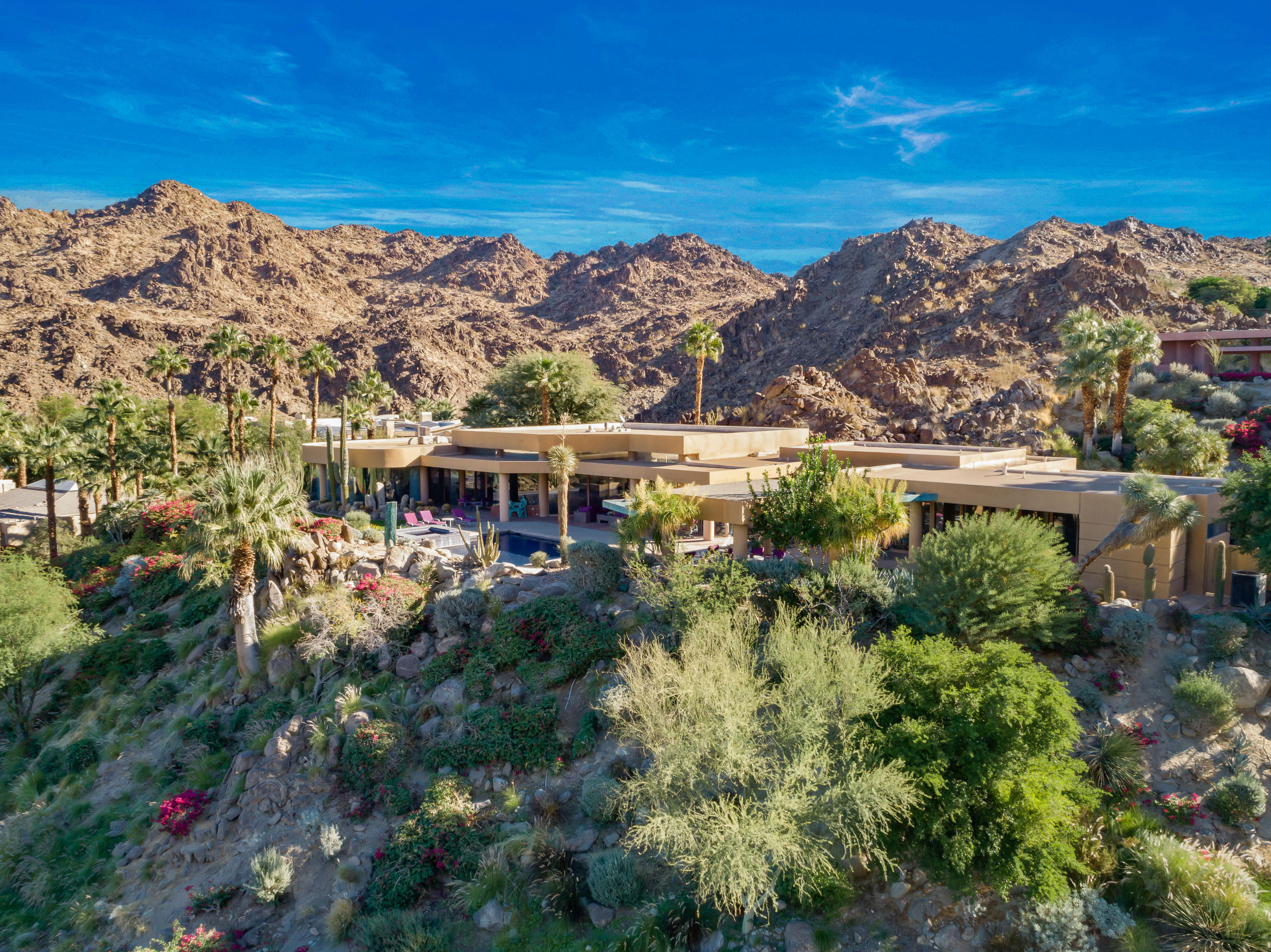 75270 Hidden Cove Indian Wells, CA 92210 - Photo 48 of 73 a view of a houses with a lush green forest