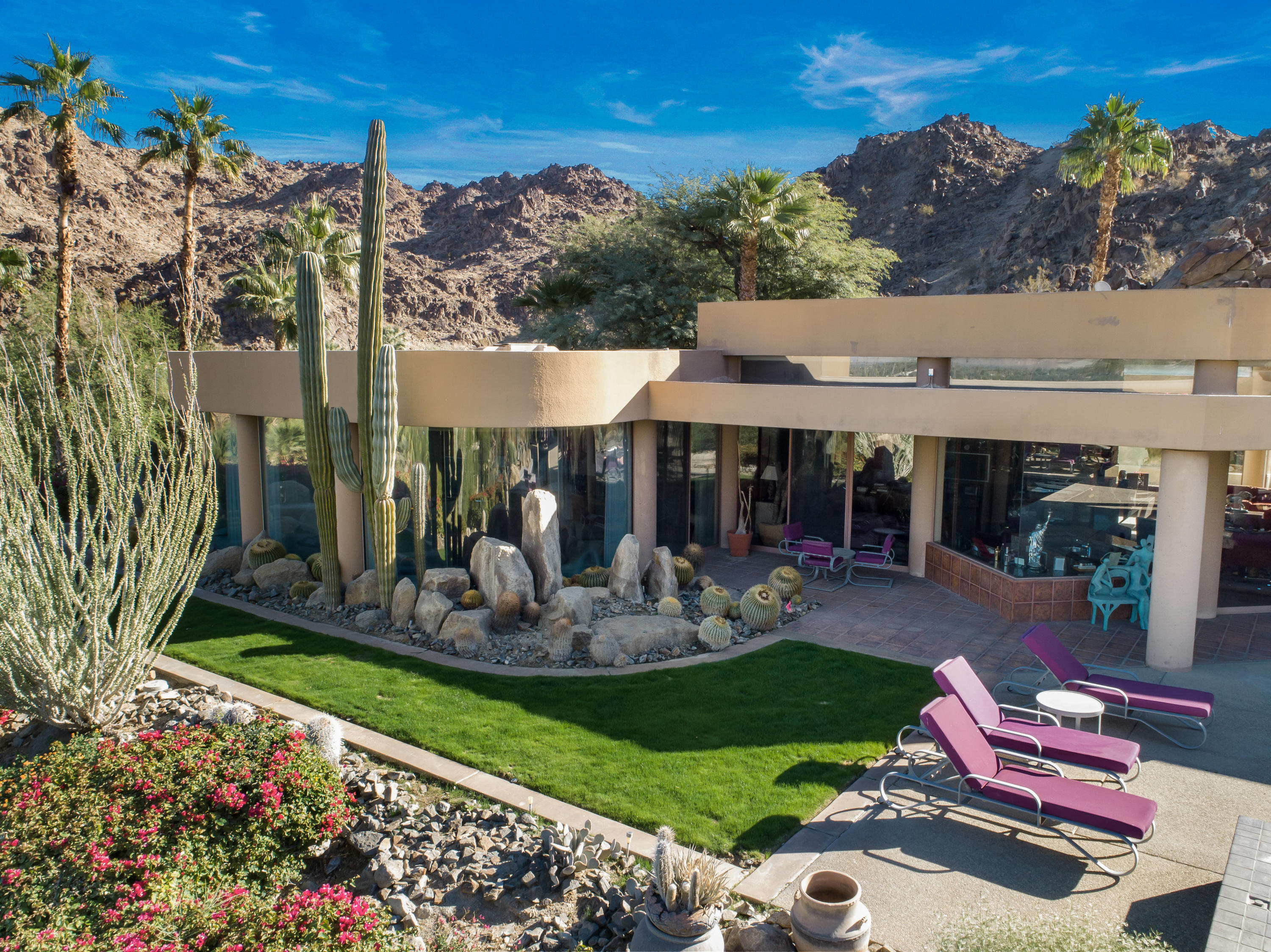75270 Hidden Cove Indian Wells, CA 92210 - Photo 51 of 73 a view of a patio with table and chairs potted plants
