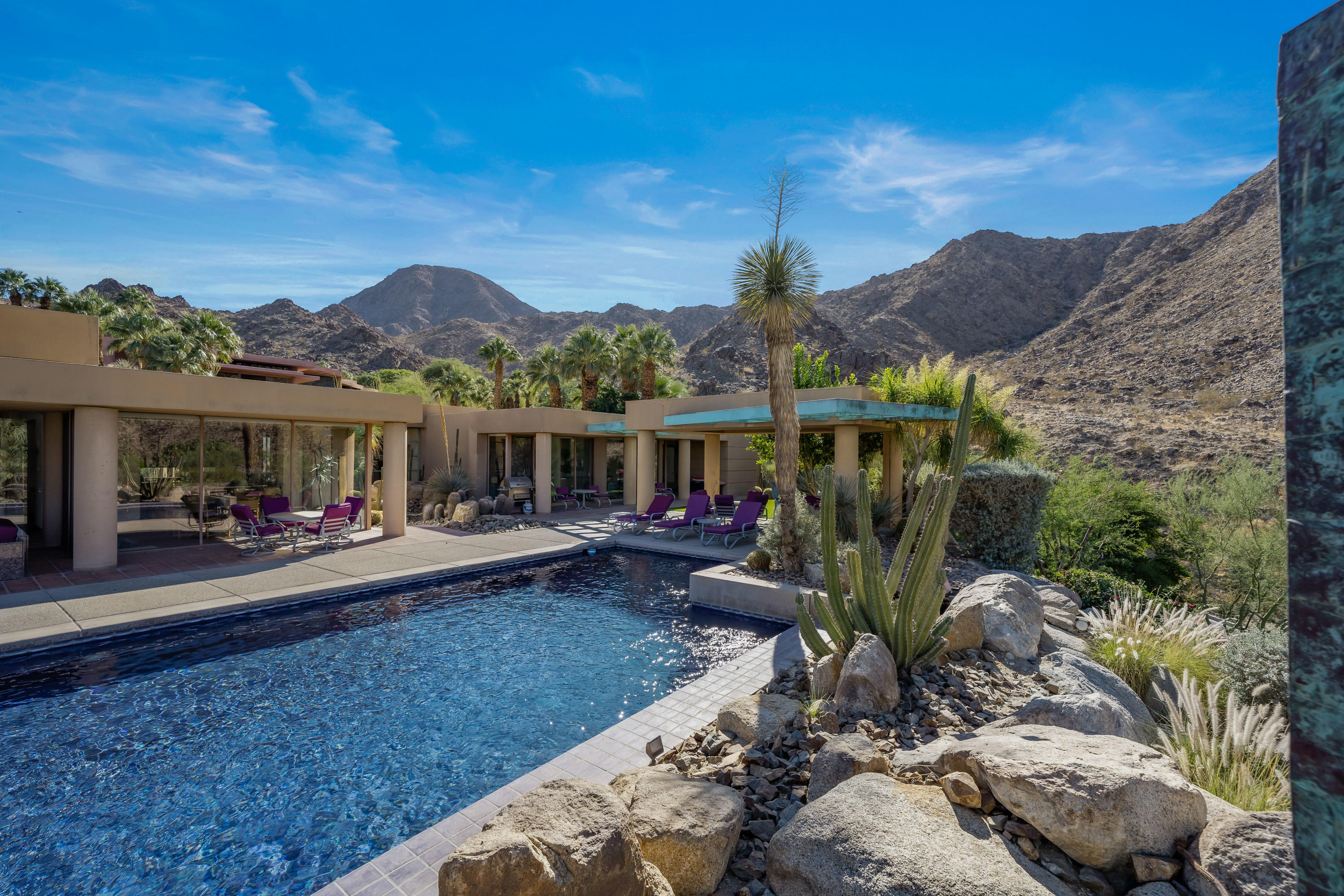75270 Hidden Cove Indian Wells, CA 92210 - Photo 60 of 73 a view of house with backyard outdoor seating and mountain view