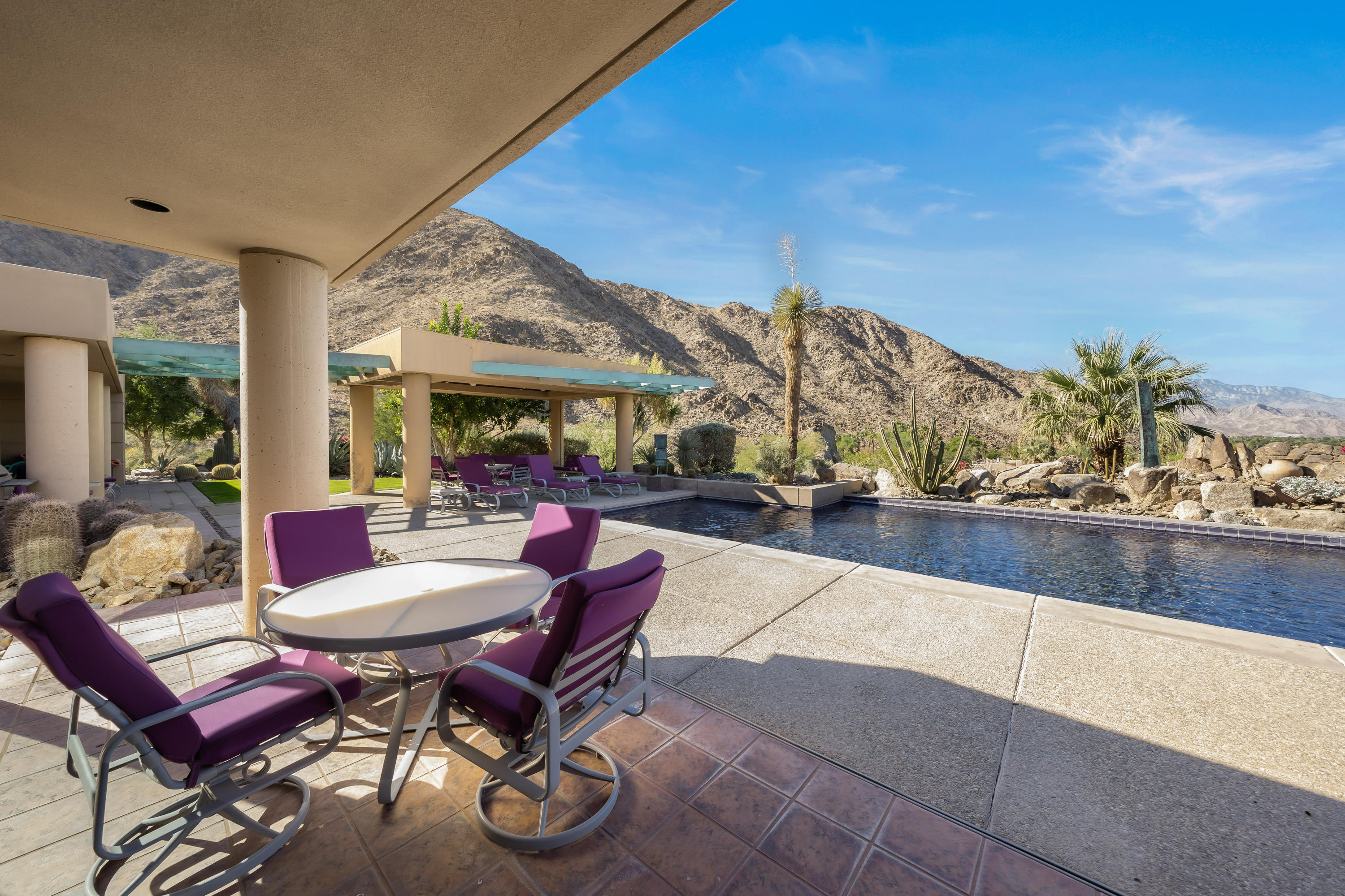 75270 Hidden Cove Indian Wells, CA 92210 - Photo 65 of 73 a view of a patio with dining table and chairs with a barbeque grill and couches